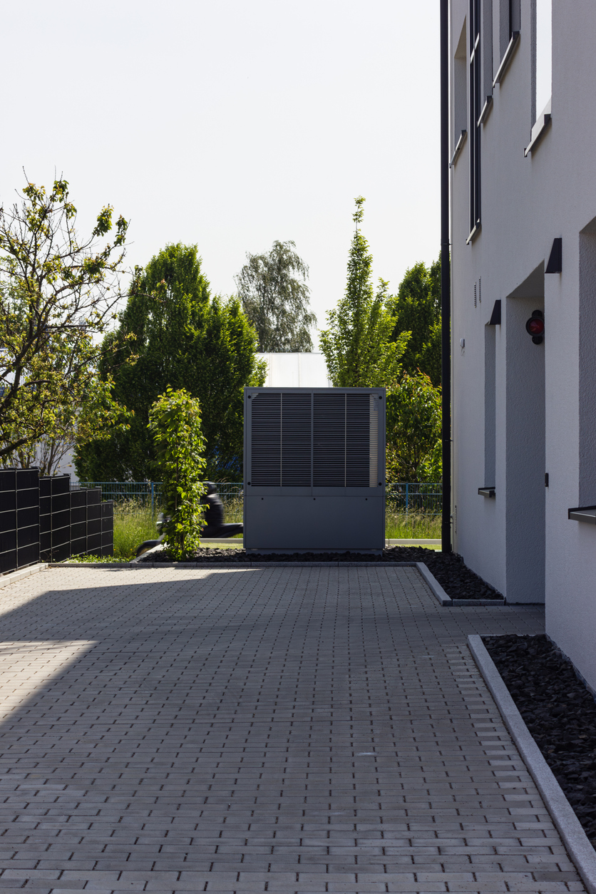 heat pump in a new building area with modern house facades heat pump in a new building area with modern house facades