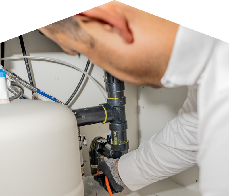 Mr Furnace plumbing specialist using a hydro jet to clear a clogged drain. Mr Furnace plumbing specialist using a hydro jet to clear a clogged drain.